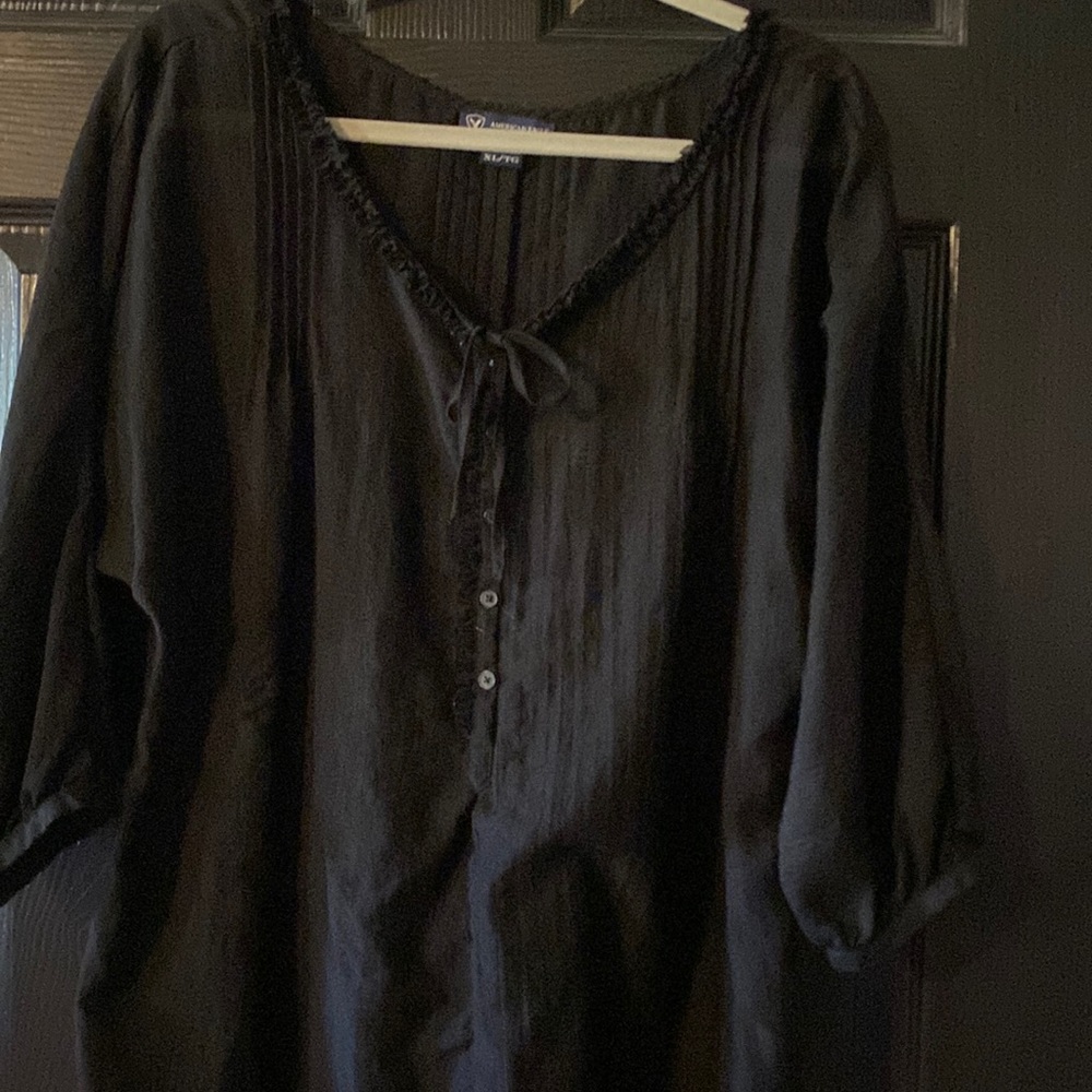 Cute black top.  Sheer type material and flowy